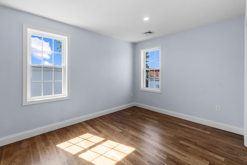 489 Spring Street Fall River, MA 02721 - Photo 33 of 42 a view of empty room with wooden floor and fan