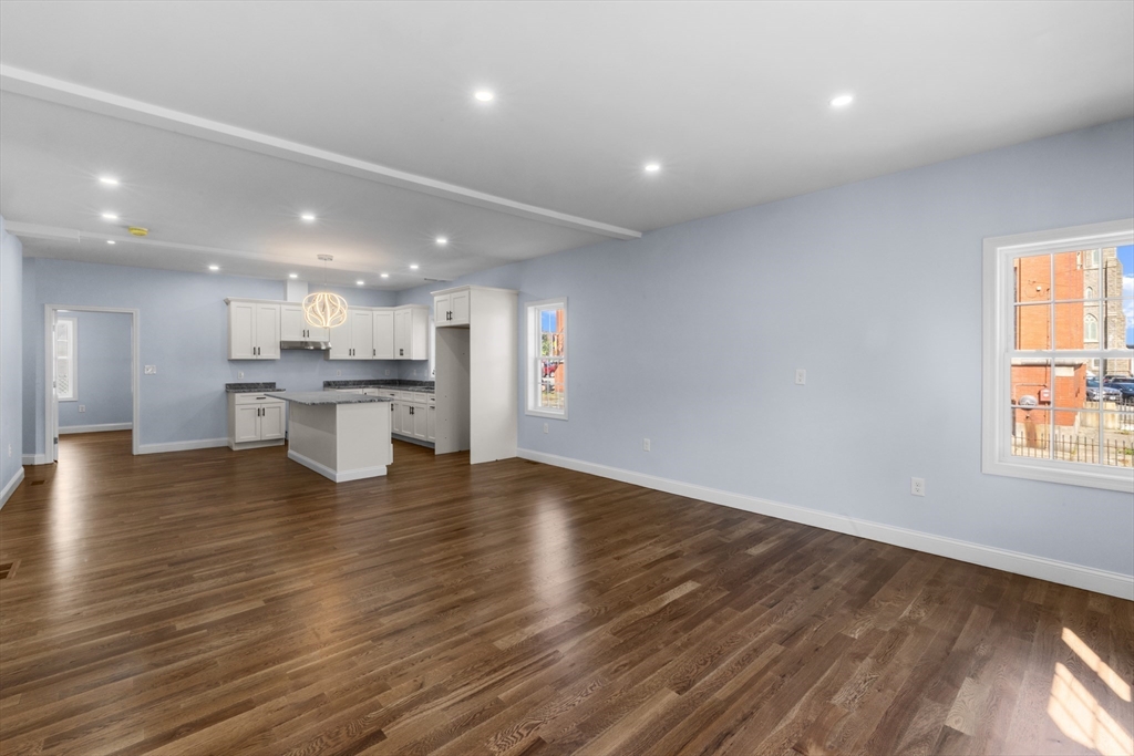 489 Spring Street Fall River, MA 02721 - Photo 4 of 42 a view of kitchen with wooden floor