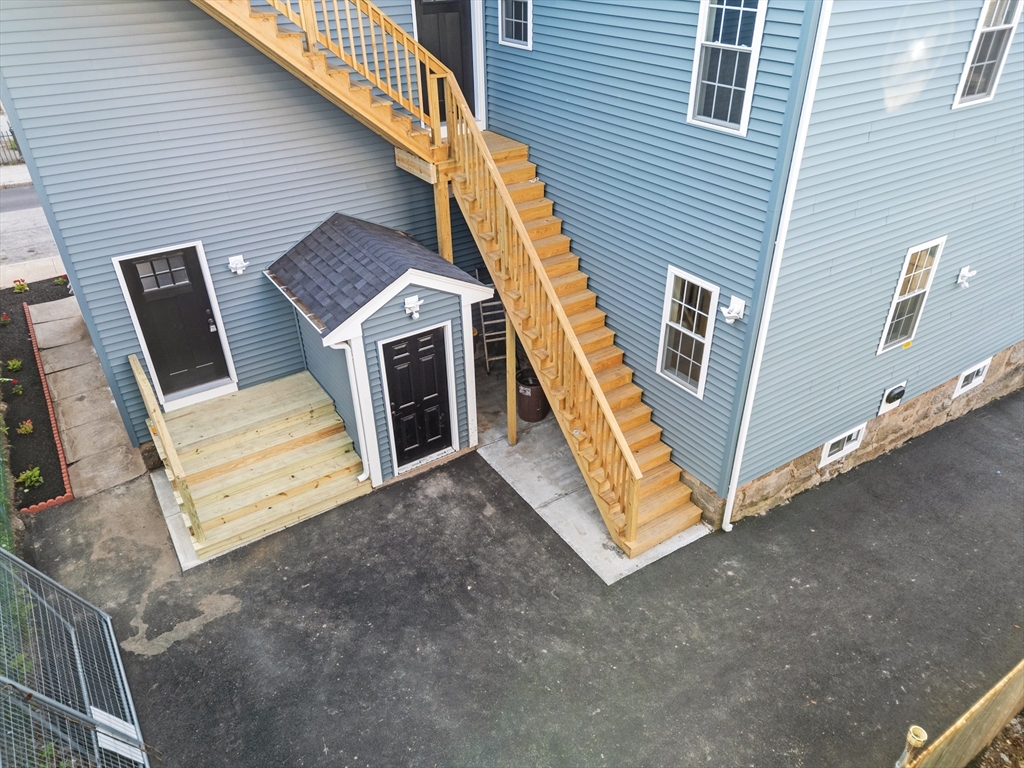 489 Spring Street Fall River, MA 02721 - Photo 41 of 42 a view of an outdoor space with roof and deck
