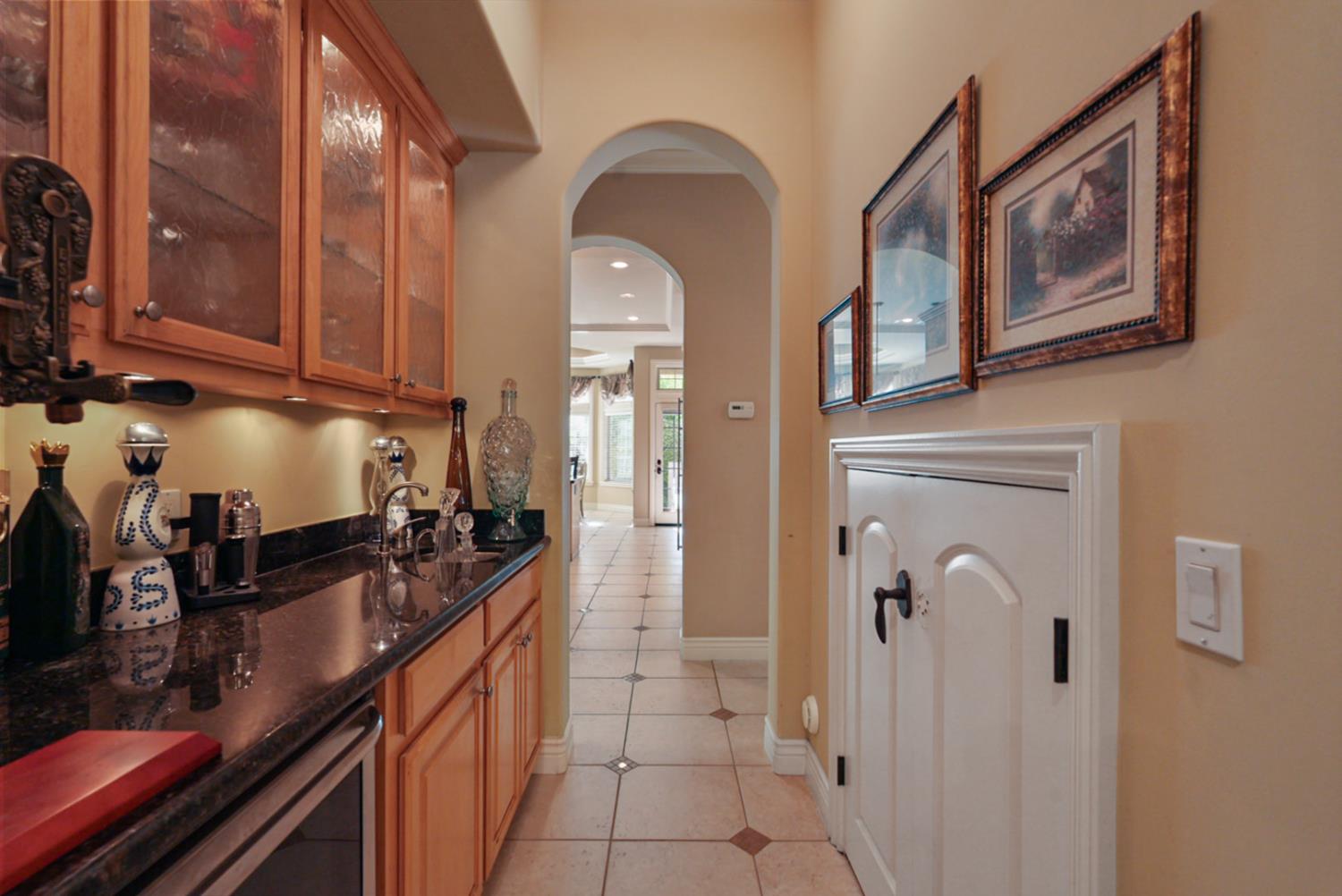 2575 Kensington Court Turlock, CA 95382 - Photo 13 of 62 a kitchen with a refrigerator and cabinets