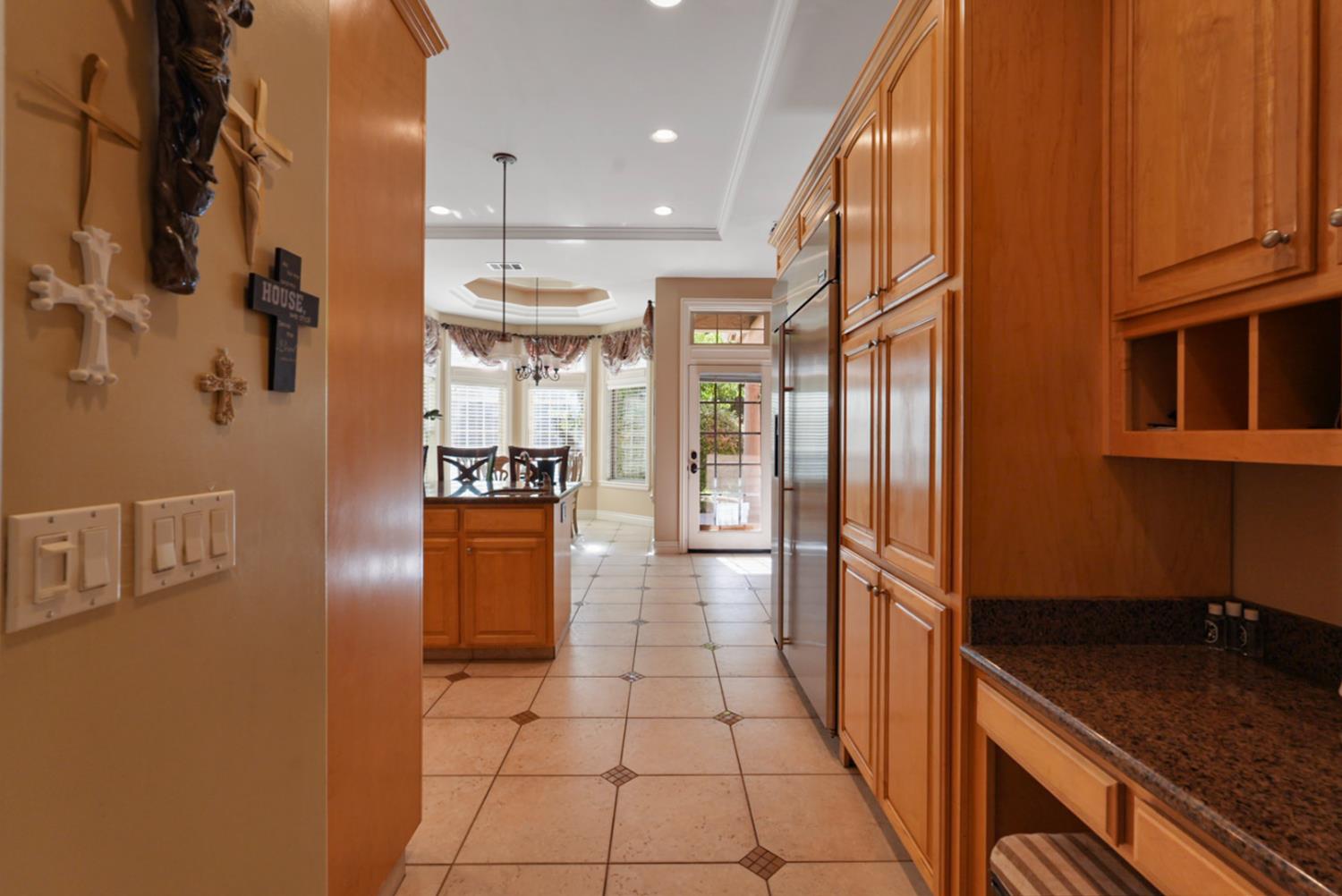 2575 Kensington Court Turlock, CA 95382 - Photo 15 of 62 a kitchen with stainless steel appliances granite countertop a refrigerator and a sink
