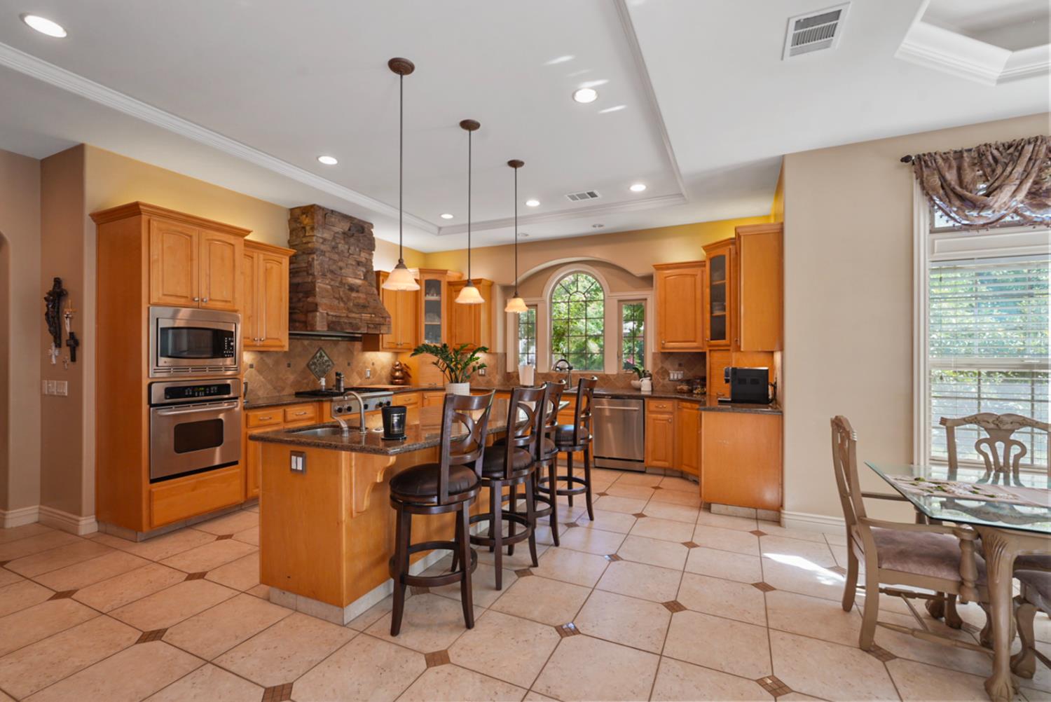 2575 Kensington Court Turlock, CA 95382 - Photo 18 of 62 a view of a dining room with furniture