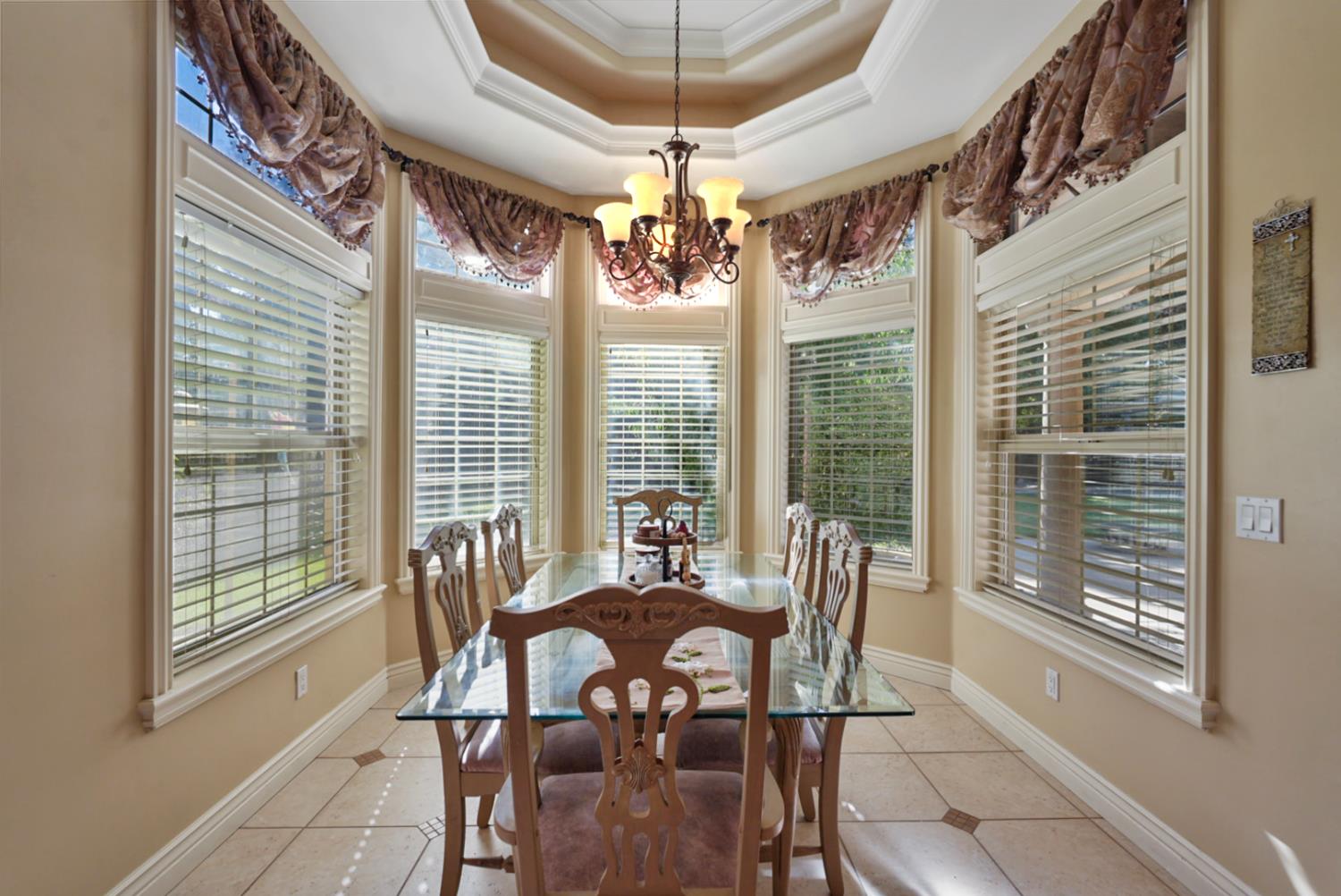 2575 Kensington Court Turlock, CA 95382 - Photo 19 of 62 a view of a dining room with furniture window and outside view