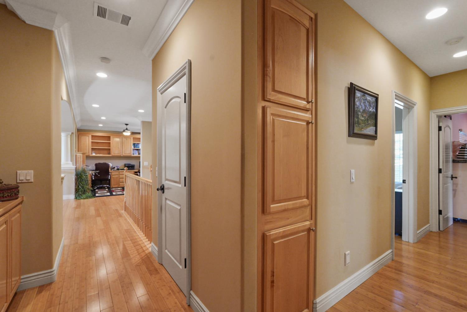 2575 Kensington Court Turlock, CA 95382 - Photo 43 of 62 a view of a hallway with wooden floor windows and livingroom