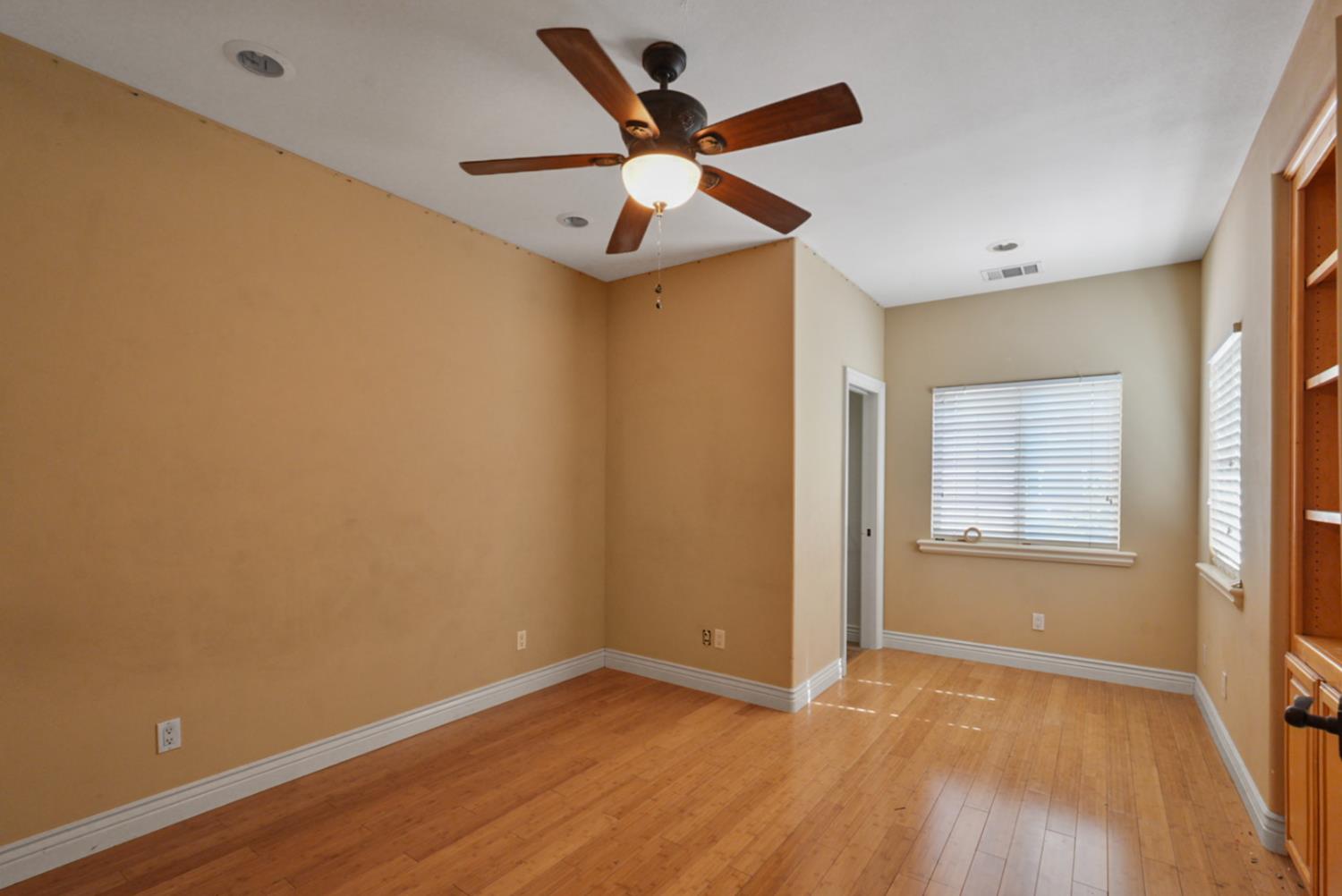 2575 Kensington Court Turlock, CA 95382 - Photo 44 of 62 wooden floor in an empty room with a window