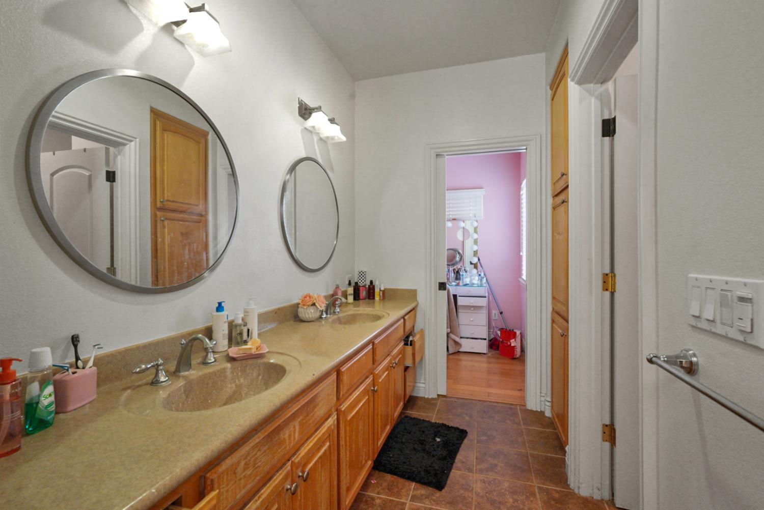 2575 Kensington Court Turlock, CA 95382 - Photo 45 of 62 a bathroom with a sink double vanity and a mirror