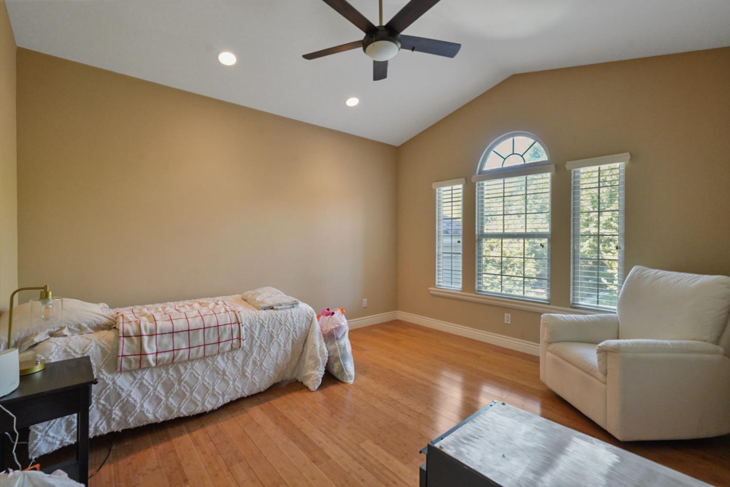 2575 Kensington Court Turlock, CA 95382 - Photo 47 of 62 a bedroom with a bed and a couch