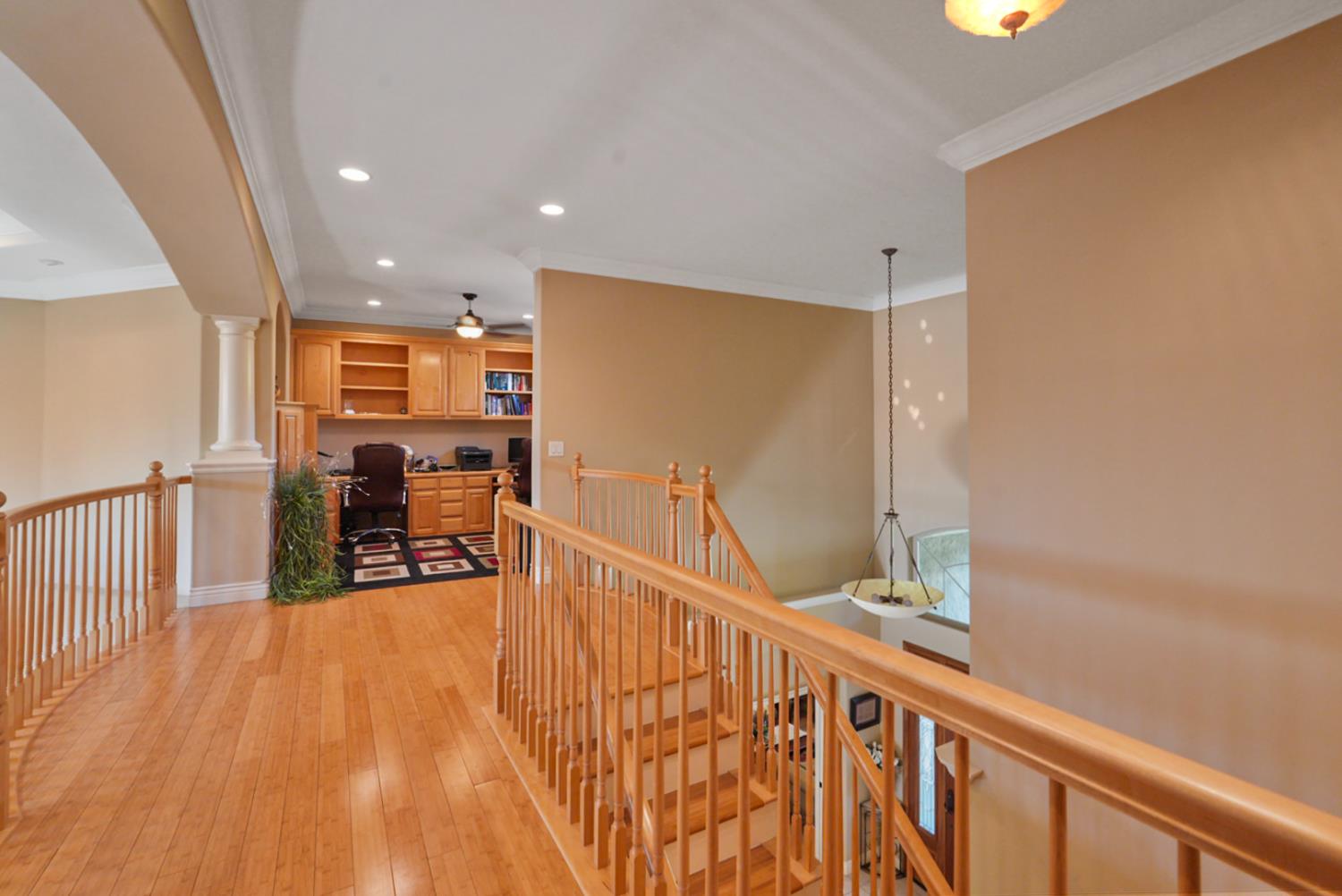 2575 Kensington Court Turlock, CA 95382 - Photo 48 of 62 a view of a hallway with wooden floor and furniture