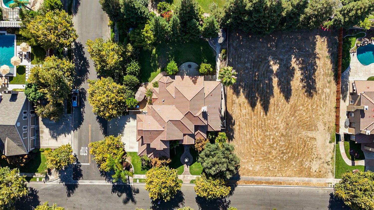 2575 Kensington Court Turlock, CA 95382 - Photo 51 of 62 an aerial view of a house with a yard and garden