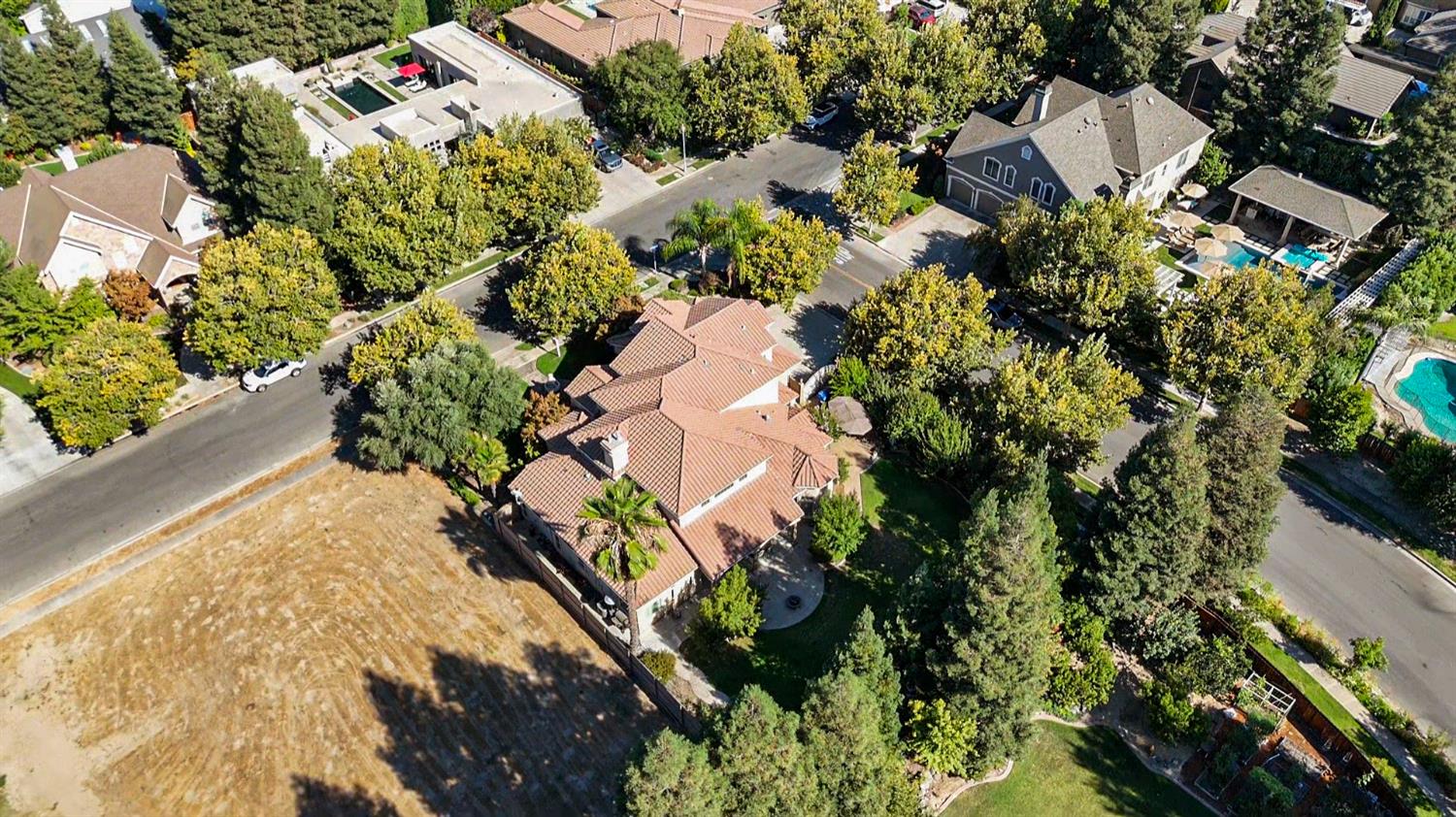 2575 Kensington Court Turlock, CA 95382 - Photo 52 of 62 an aerial view of a house with a yard and garden