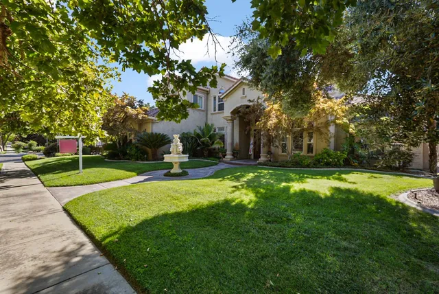 a living room with fireplace furniture and a flat screen tv