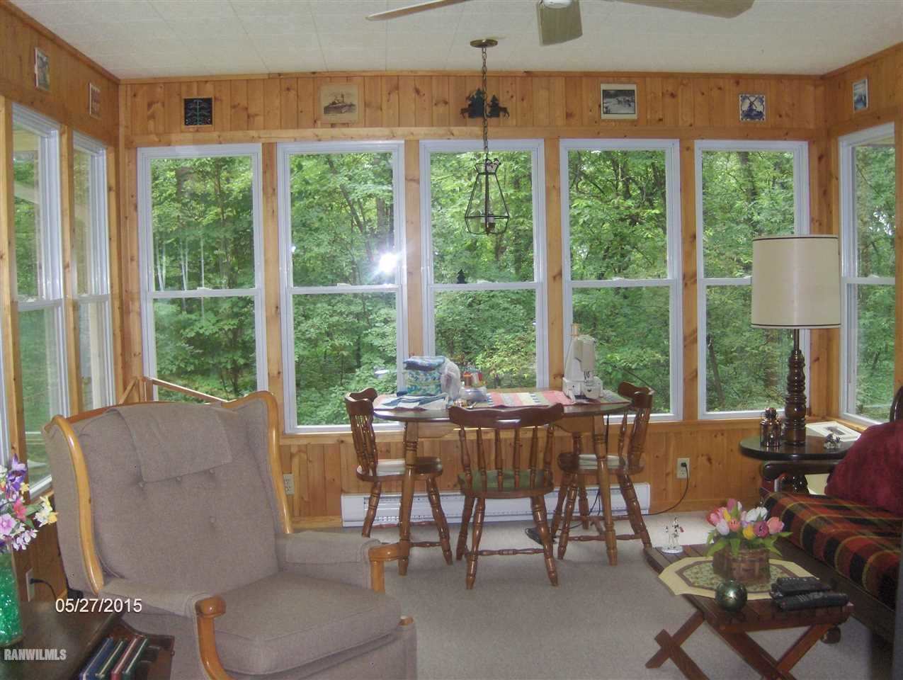8516 East Maize Road Ridott, IL 61067 - Photo 11 of 21 a living room with furniture and a large window