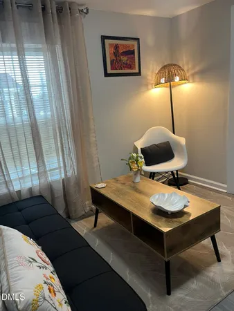 a view of a workspace with furniture