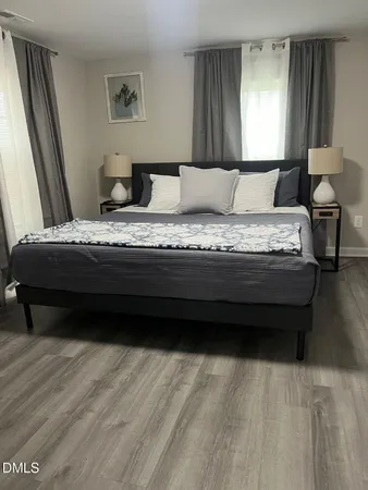 a bedroom with a bed and window