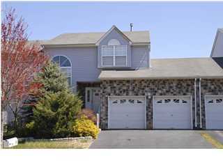 a black and white photo of a house