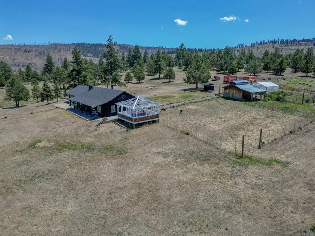 a view of a yard with furniture and outdoor space