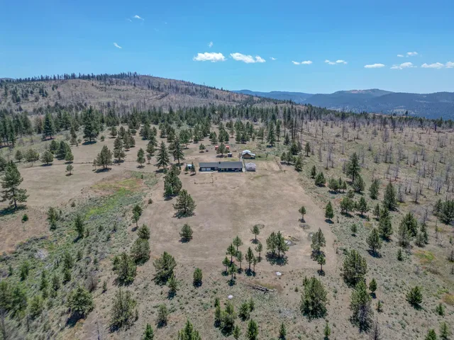 a view of a town with mountains in the background