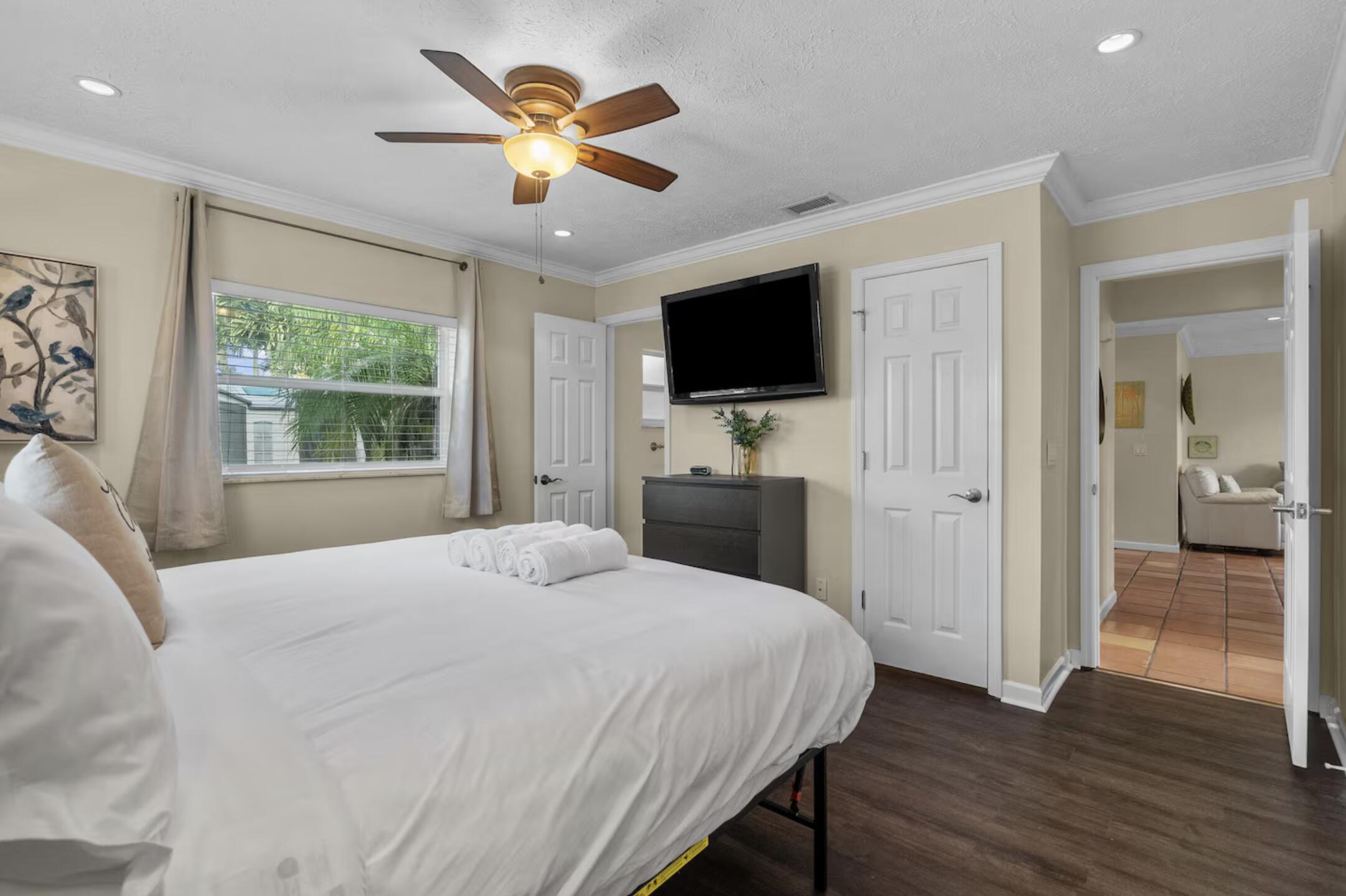 991 Southeast Walters Terrace Port St. Lucie, FL 34983 - Photo 12 of 19 a bedroom with a bed and a flat screen tv