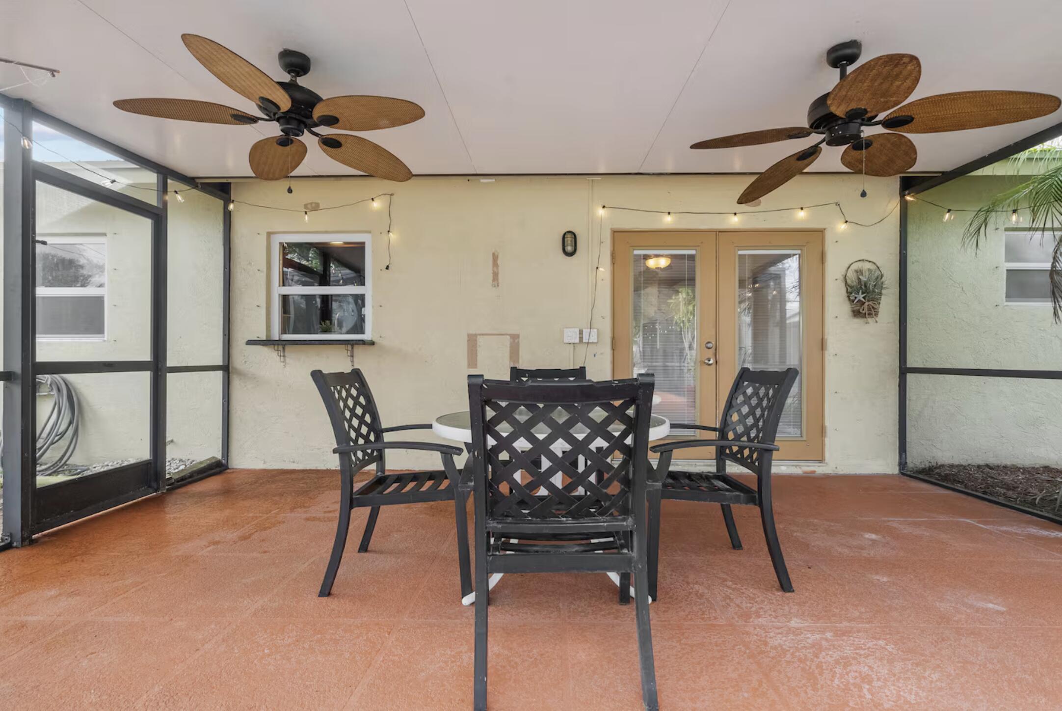 991 Southeast Walters Terrace Port St. Lucie, FL 34983 - Photo 19 of 19 a view of a dining room with furniture and a chandelier