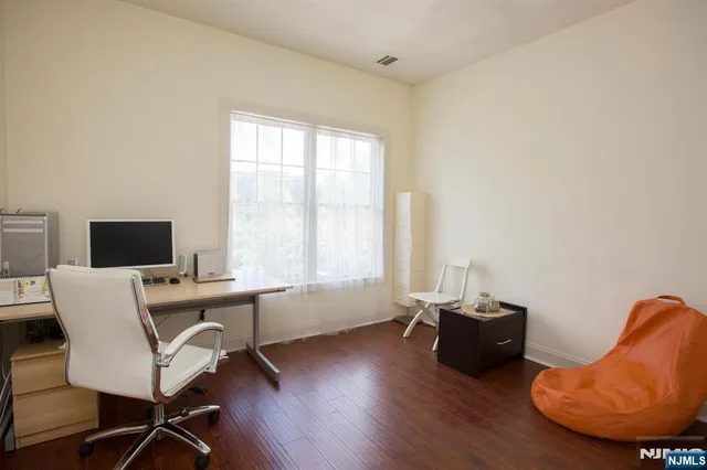 a workspace with furniture and a window