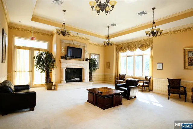 a living room with furniture fireplace and a flat screen tv