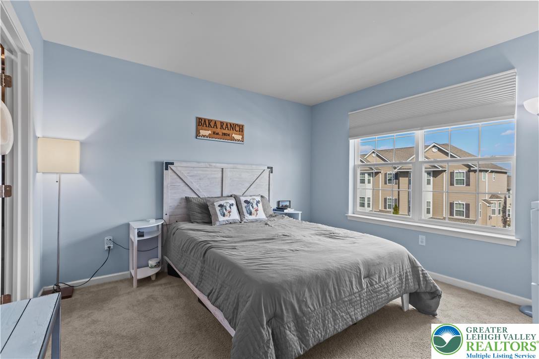 2260 Rising Hill Road Whitehall, PA 18052 - Photo 19 of 30 a bedroom with a bed and a large window