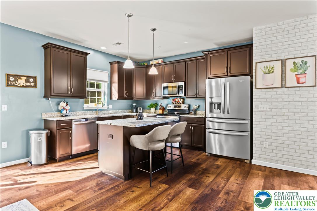 2260 Rising Hill Road Whitehall, PA 18052 - Photo 9 of 30 a kitchen with stainless steel appliances a refrigerator stove microwave and sink