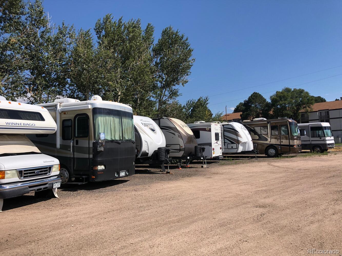 610 South Alton Way, Unit 8D Denver, CO 80247 - Photo 45 of 50 a view of cars parked in a parking lot