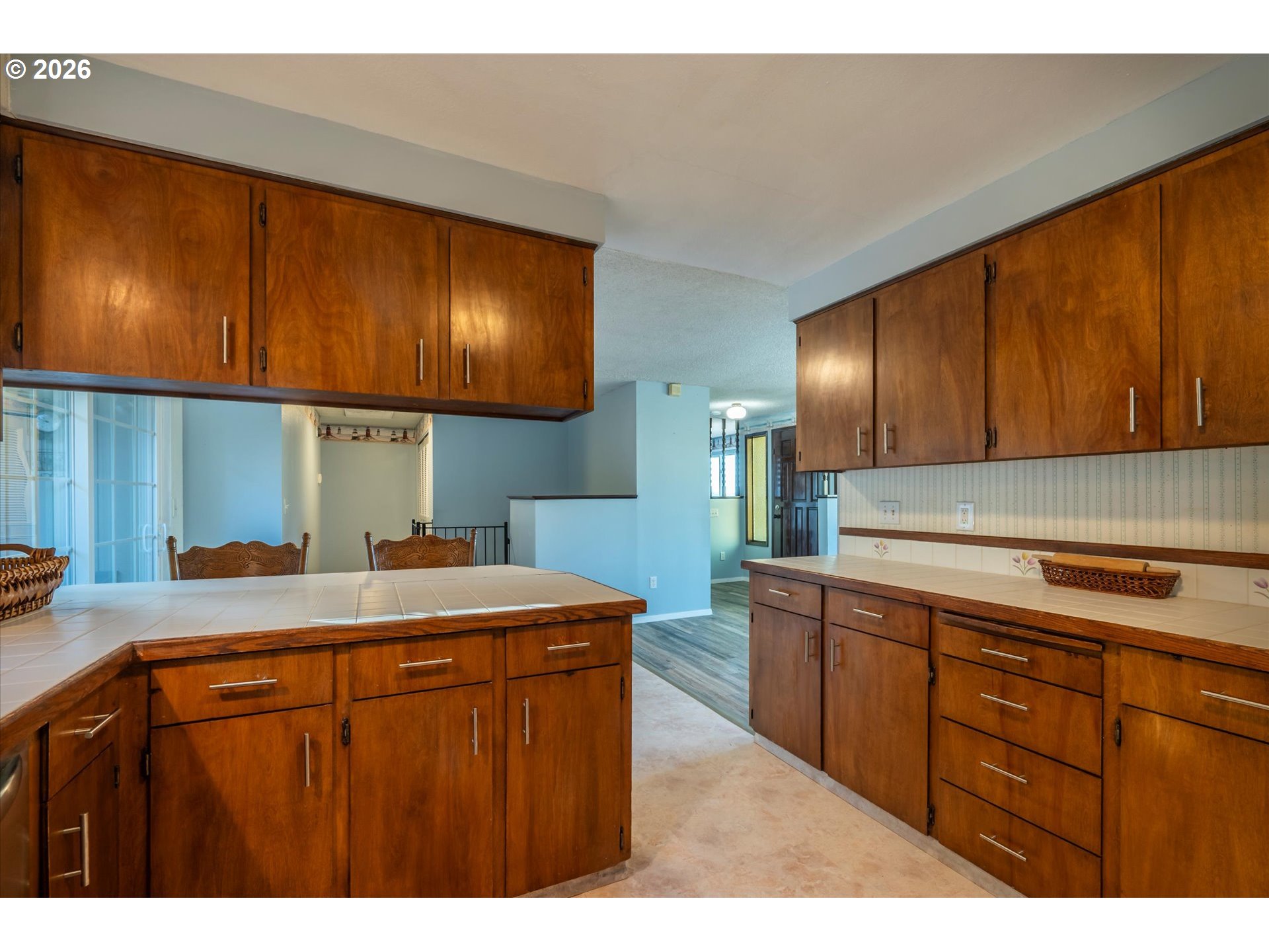 1376 D Street Coos Bay, OR 97420 - Photo 13 of 44 a kitchen with a sink a stove cabinets and a window