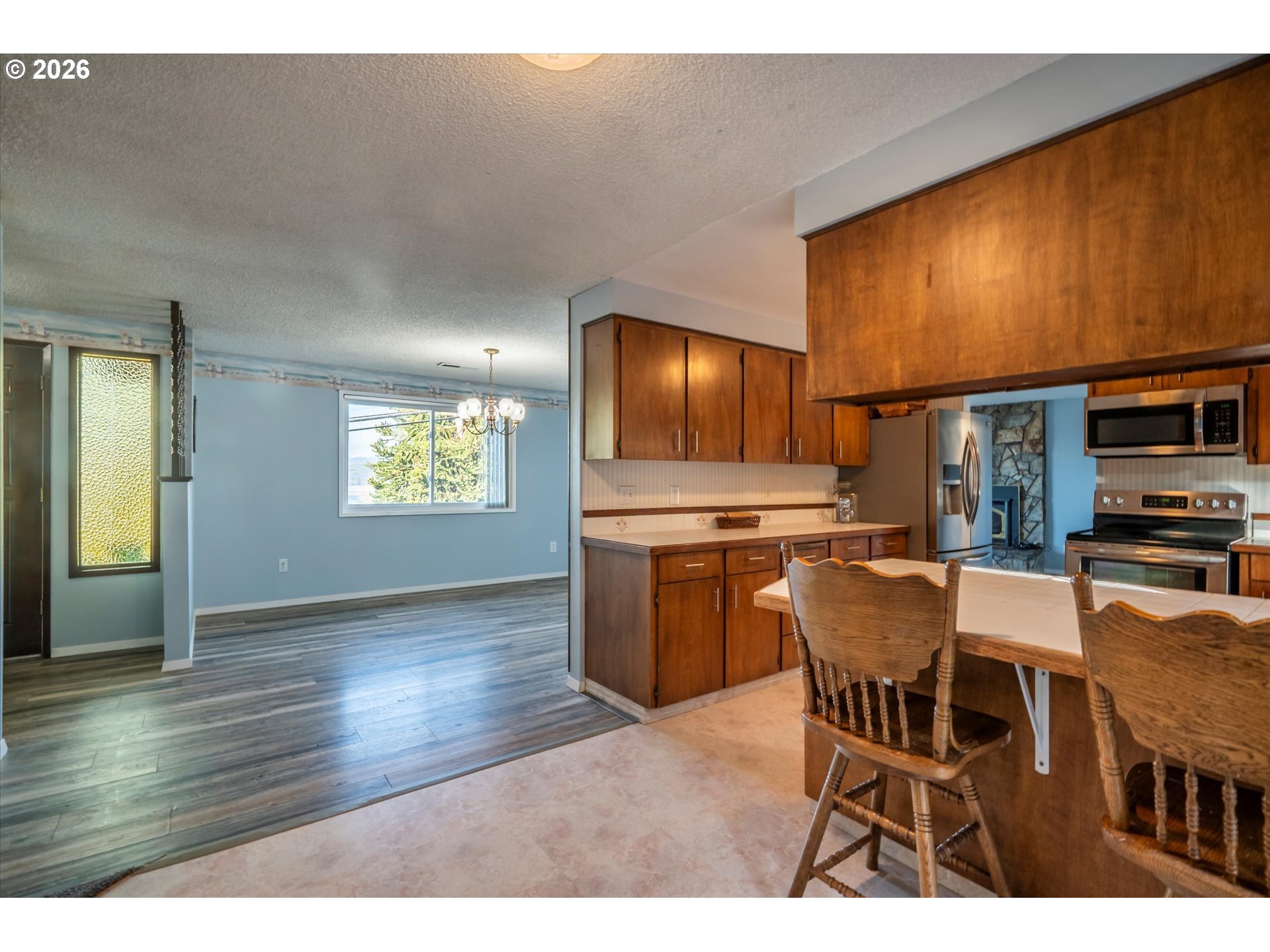 1376 D Street Coos Bay, OR 97420 - Photo 16 of 44 a view of a dining room with furniture and wooden floor