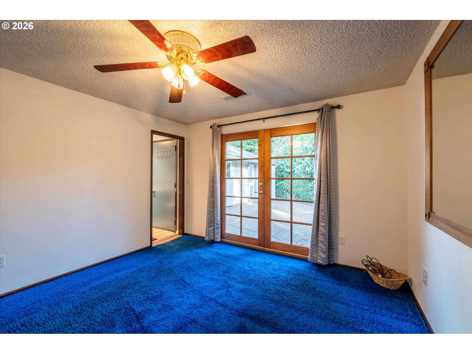 1376 D Street Coos Bay, OR 97420 - Photo 19 of 44 a view of an empty room with wooden floor and a window