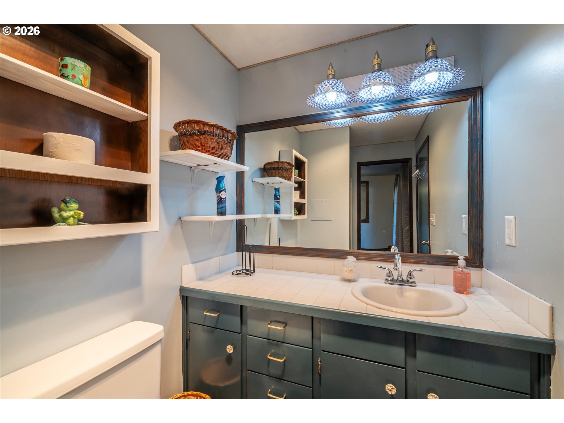 1376 D Street Coos Bay, OR 97420 - Photo 20 of 44 a bathroom with a sink double vanity and a mirror