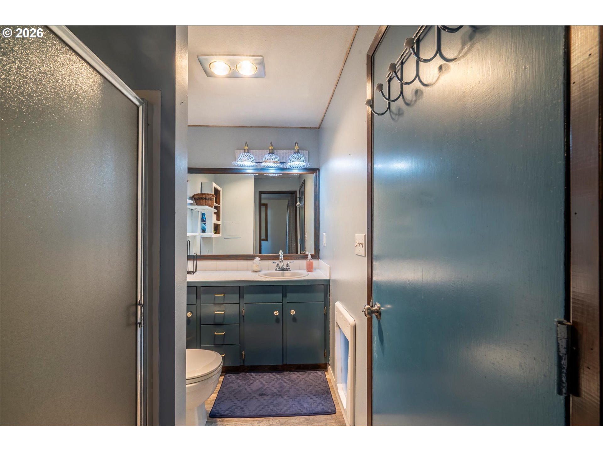 1376 D Street Coos Bay, OR 97420 - Photo 21 of 44 a bathroom with a sink and a mirror