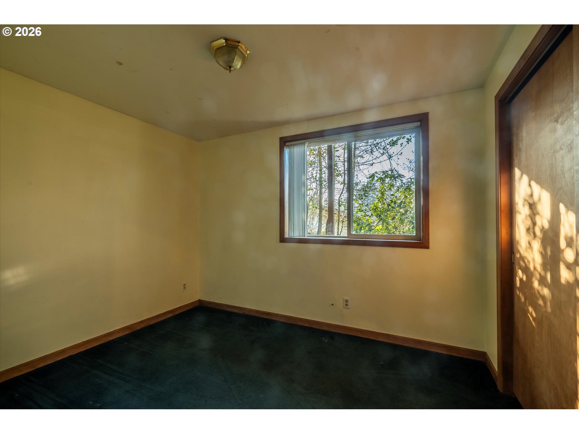 1376 D Street Coos Bay, OR 97420 - Photo 23 of 44 a view of an empty room with a window