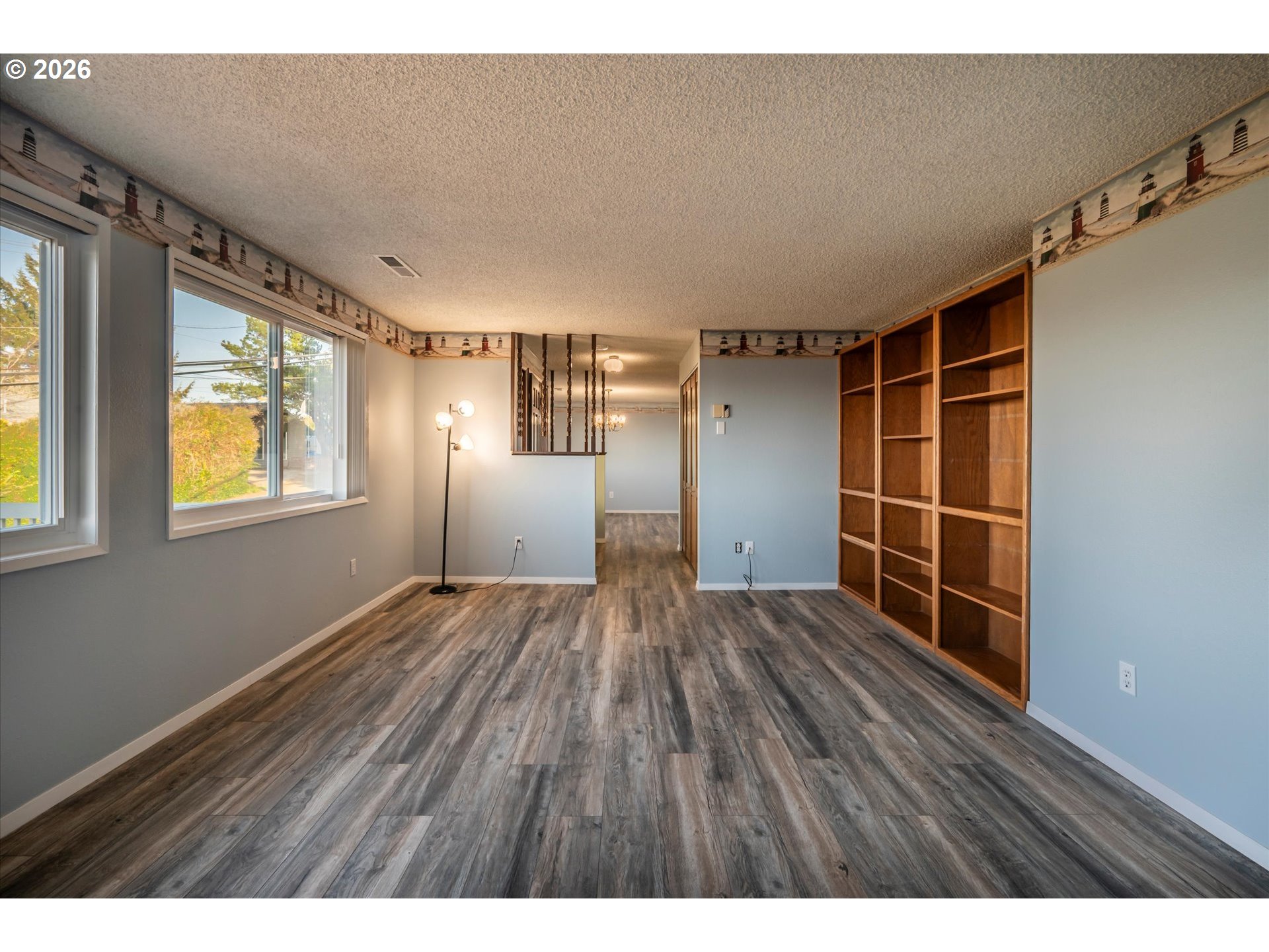 1376 D Street Coos Bay, OR 97420 - Photo 25 of 44 a view of empty room with wooden floor and fan