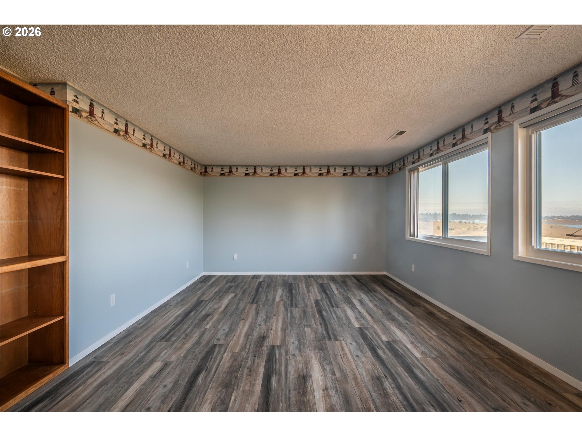 1376 D Street Coos Bay, OR 97420 - Photo 26 of 44 a view of an empty room with a window