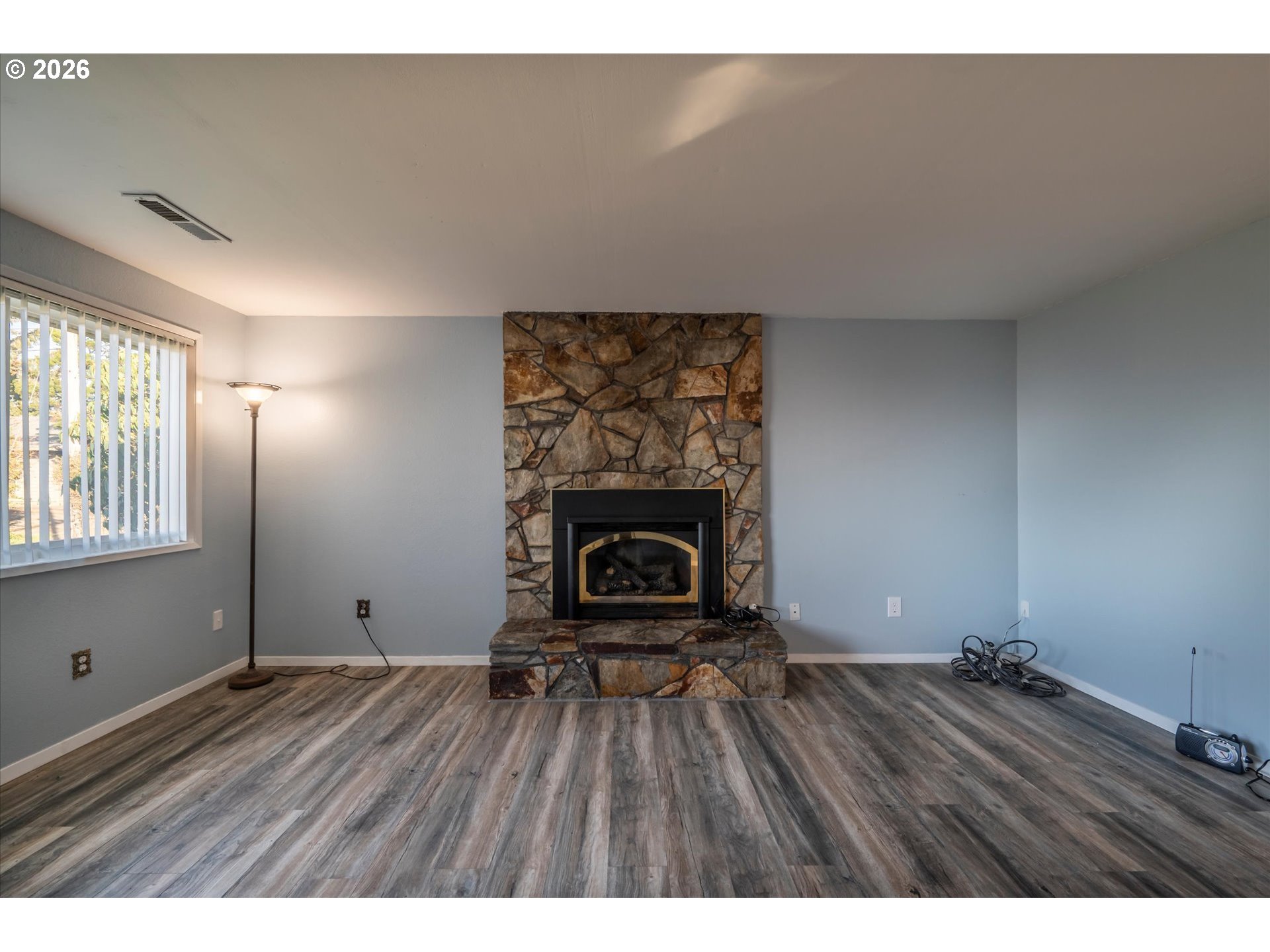 1376 D Street Coos Bay, OR 97420 - Photo 30 of 44 a view of an empty room and wooden floor