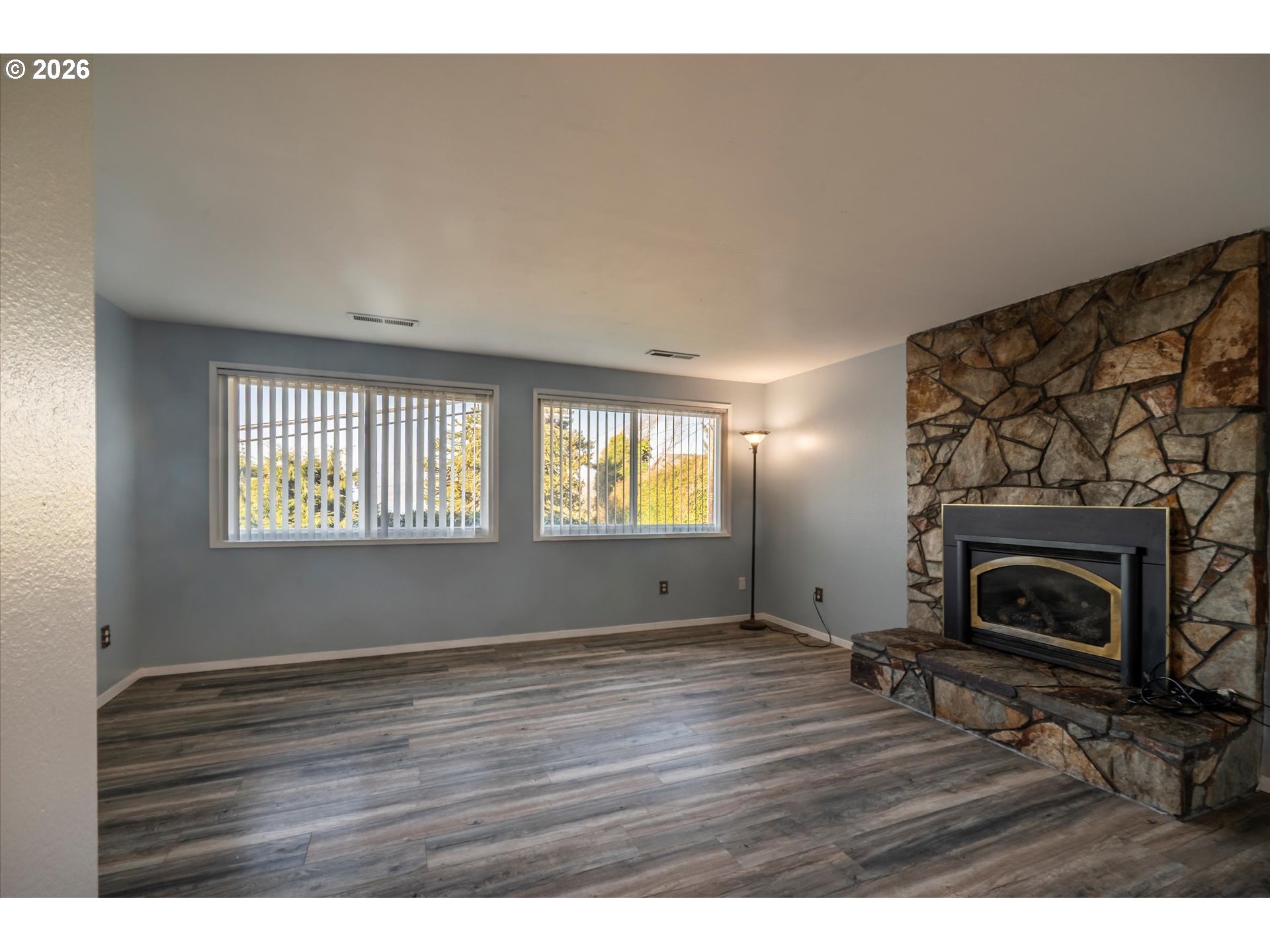 1376 D Street Coos Bay, OR 97420 - Photo 31 of 44 a view of empty room with window and fireplace
