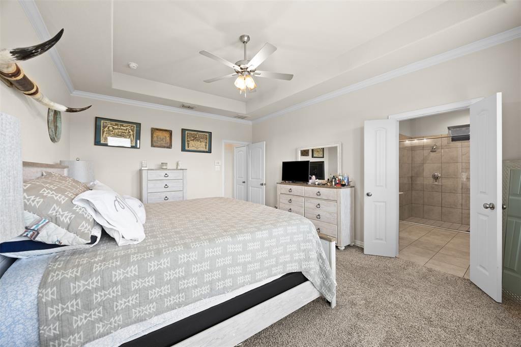 2618 Byrd Ranch Road Midlothian, TX 76065 - Photo 23 of 38 a bedroom with a bed and a flat screen tv