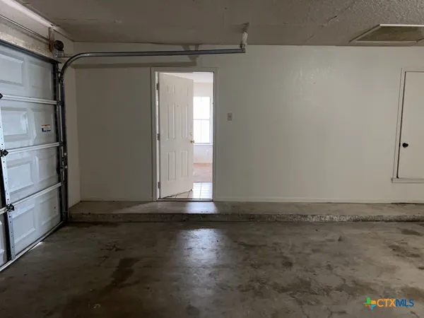 a view of a room with wooden walls