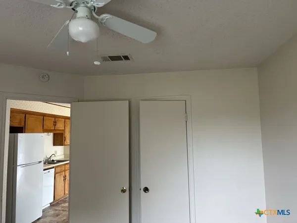 a view of a hallway with a chandelier
