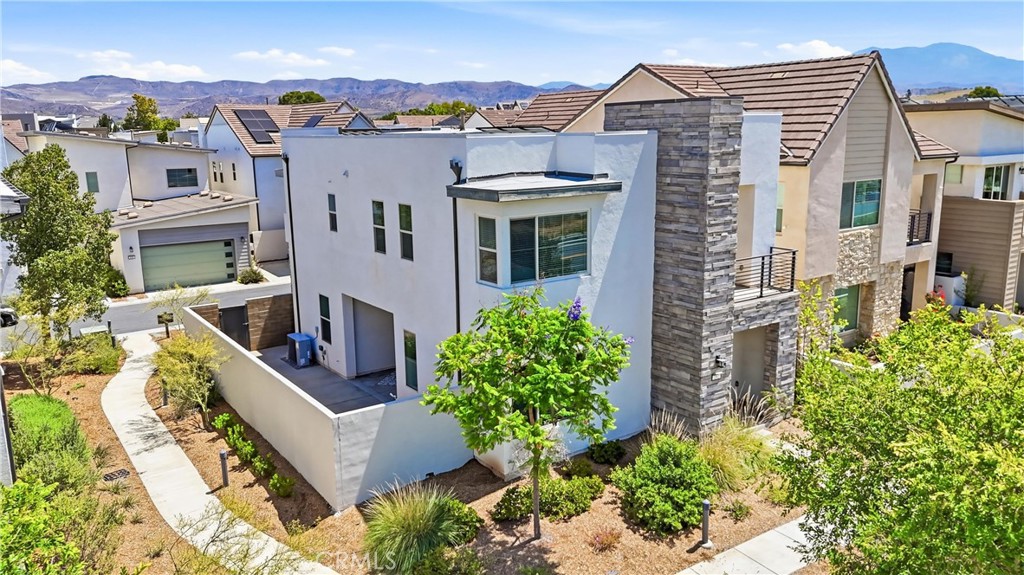 182 Scale Irvine, CA 92618 - Photo 49 of 61 The rear of the home from above, with open sky, the Great Park corridor in the distance, and a private courtyard ready for your next gathering.