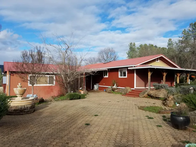 a bedroom with a bed and a lamp