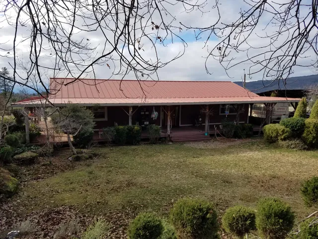 a view of a lake with a yard