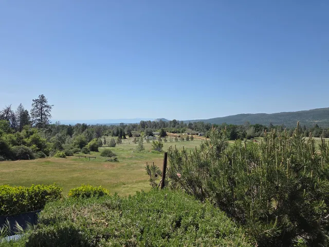 a view of a lake with a big yard