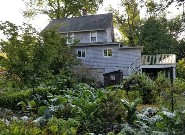 a view of a wooden deck with a yard