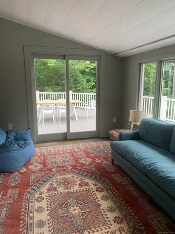 a large bed sitting in a bedroom next to a window