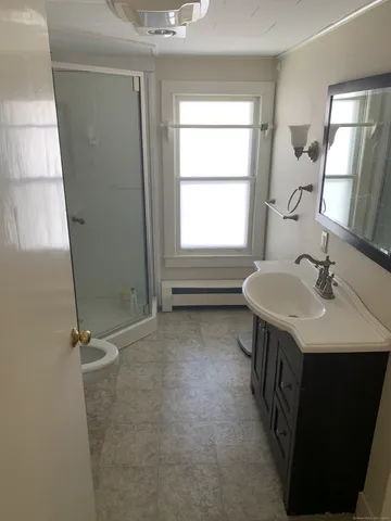 a bedroom with a bed and cabinets