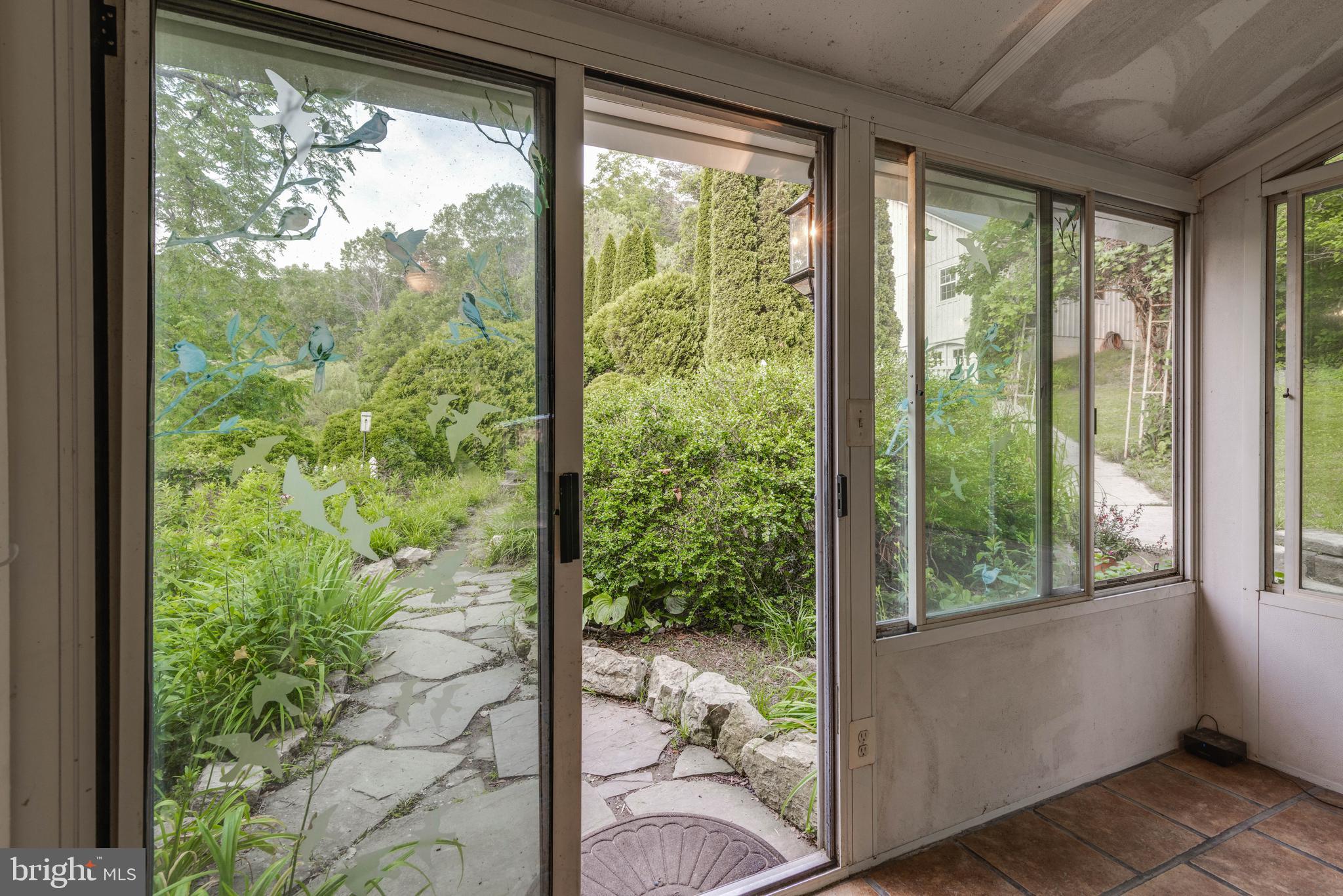1801 Stringtown Road Sparks Glencoe, MD 21152 - Photo 11 of 26 a view of a room that has a bed and wooden floor