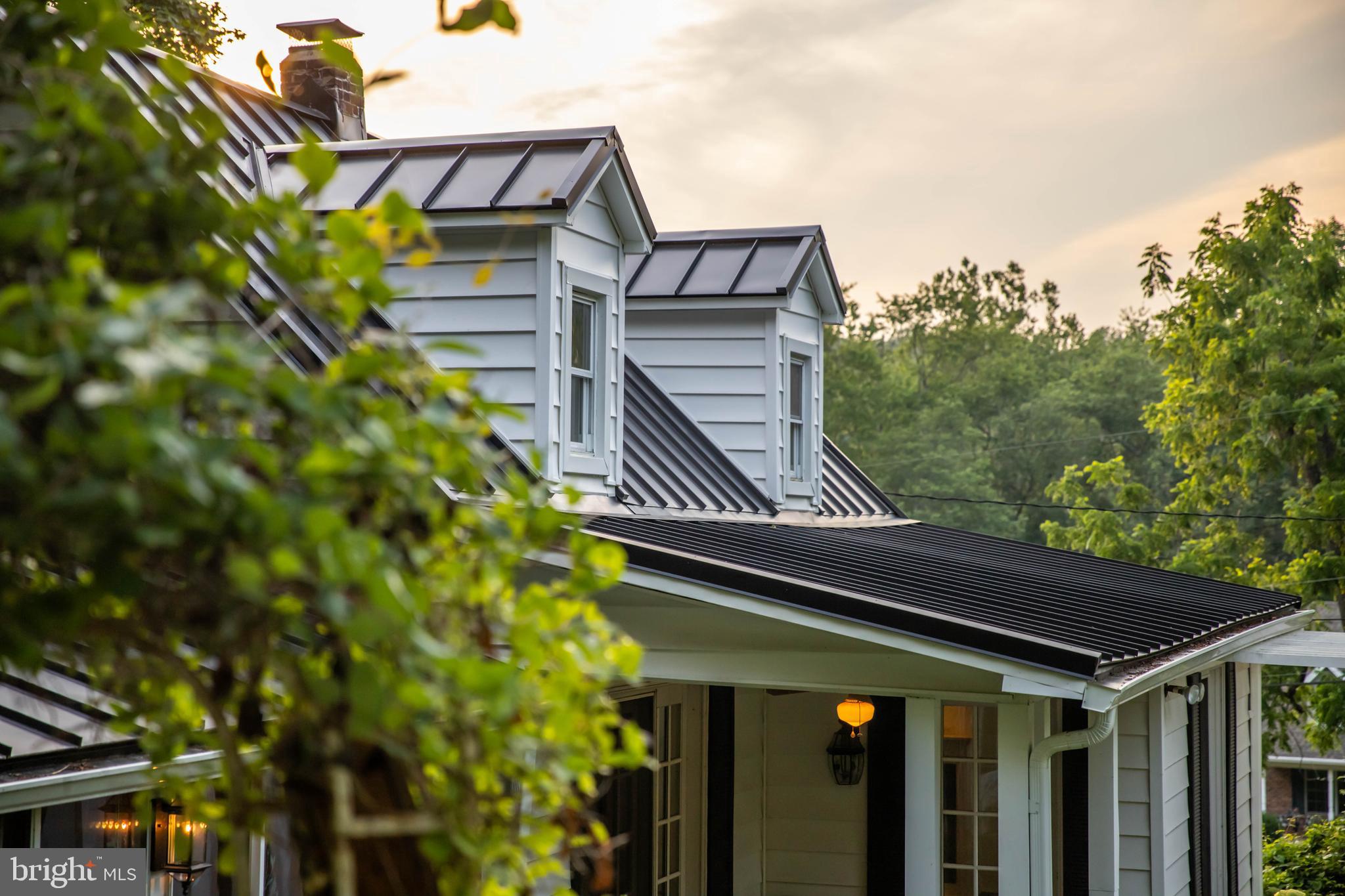 1801 Stringtown Road Sparks Glencoe, MD 21152 - Photo 2 of 26 a front view of a house with plants